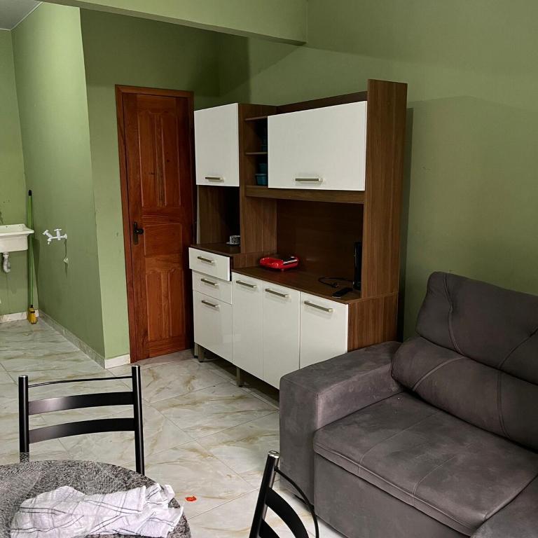 a living room with a couch and a table at Casa do Will in Ananindeua