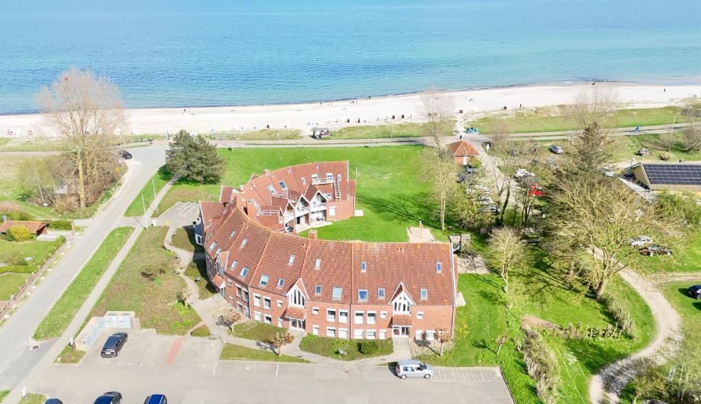 an aerial view of a large house next to the beach at Ostseeferienwohnung - Bossert in Kronsgaard