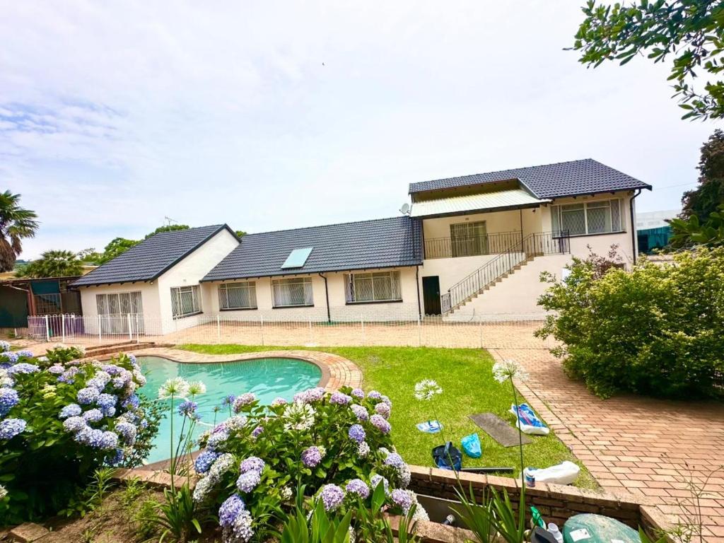 a house with a swimming pool in the yard at Crest Premium in Johannesburg