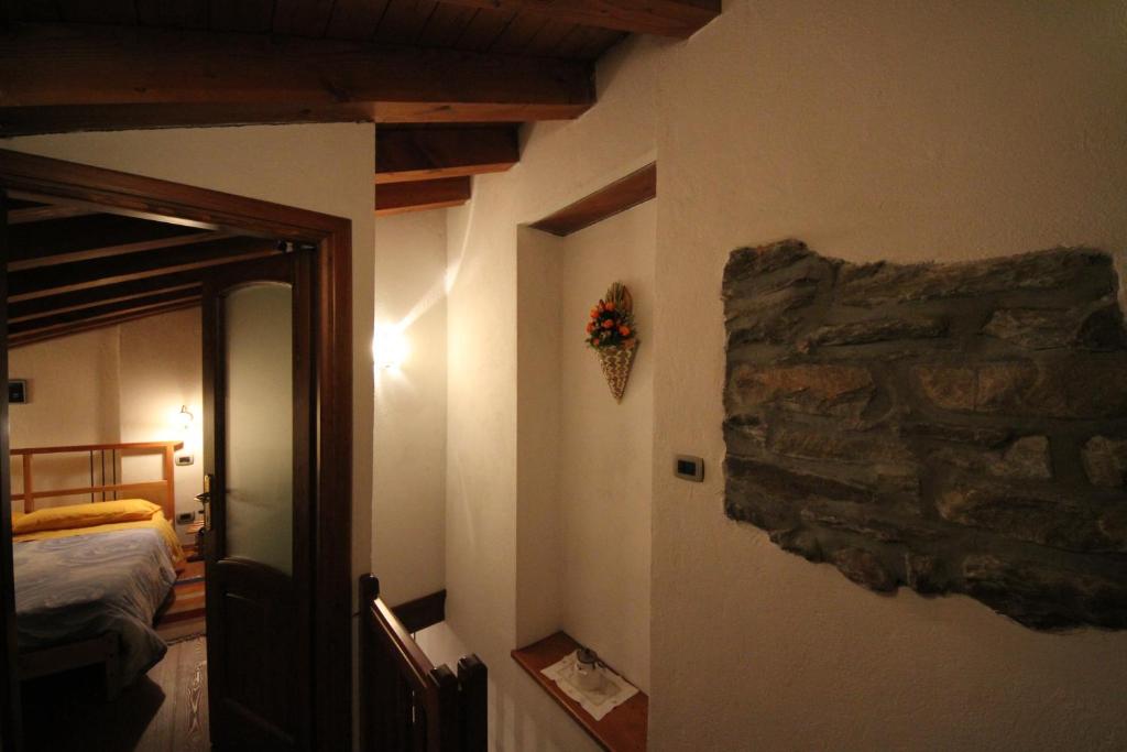 Posteľ alebo postele v izbe v ubytovaní B&B Vecchio Torchio di Bard