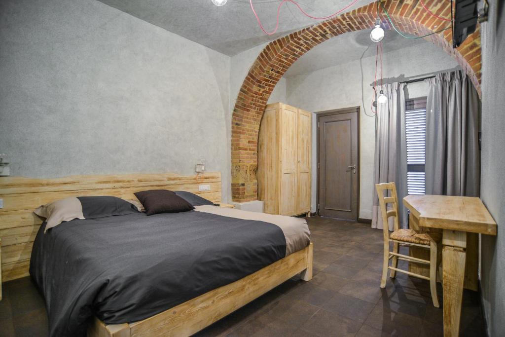 Säng eller sängar i ett rum på Agriturismo La Collina