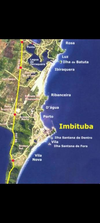 a map of the shoreline of the ocean with a road at Loft e casa Catarina in Imbituba