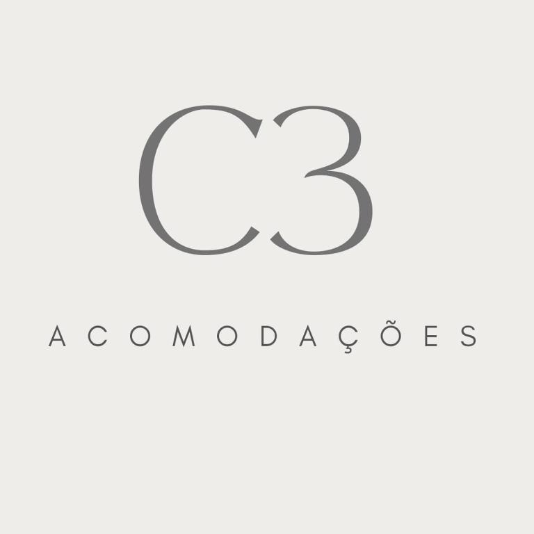 a gray cloud logo on a white background at C3 STUDIO in Rio de Janeiro