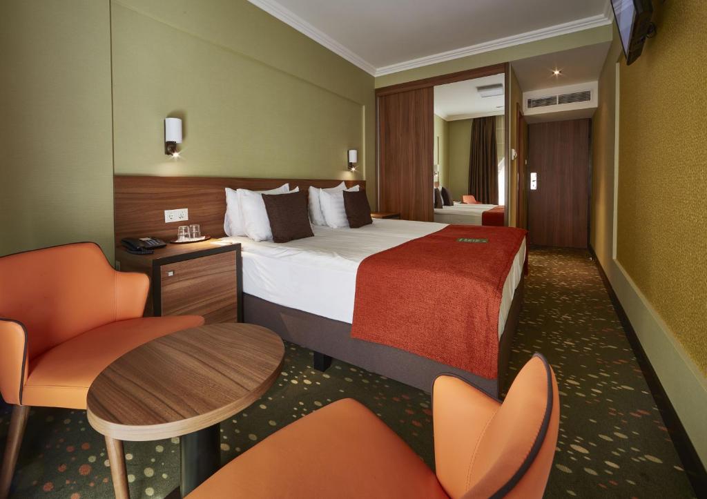 Posteľ alebo postele v izbe v ubytovaní Budget Hotel Victoria