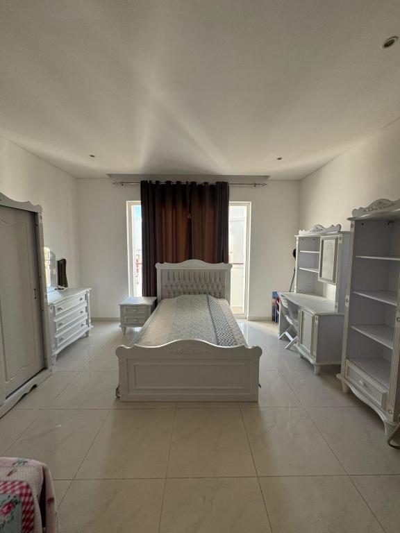 Llit o llits en una habitació de Al Mouj