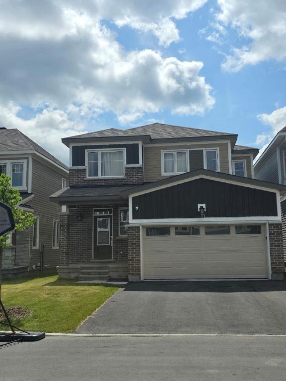 a house with a garage at Basement with 2 rooms in Ottawa