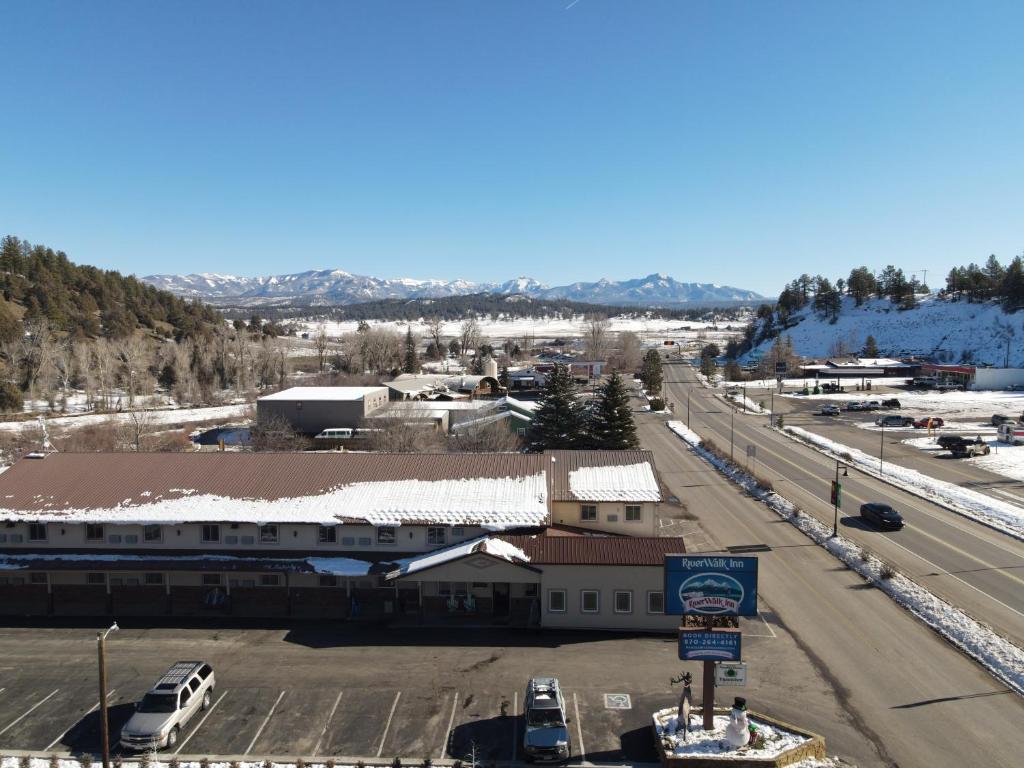 an aerial view of a town with cars parked in a parking lot at RiverWalk Inn in Pagosa Springs