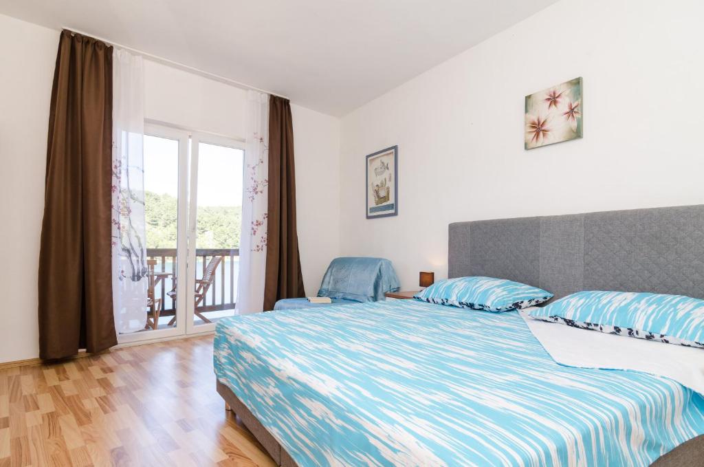 Postel nebo postele na pokoji v ubytování Apartments Matana Chano
