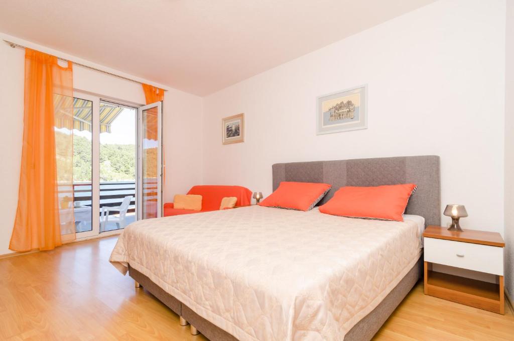 Postel nebo postele na pokoji v ubytování Apartments Matana Chano