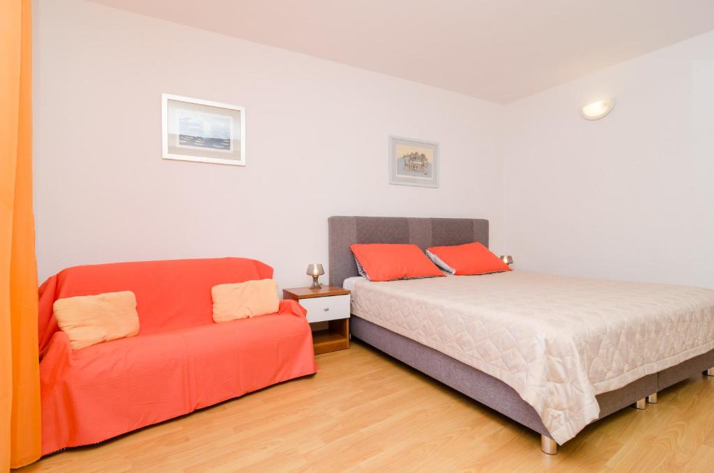 Postel nebo postele na pokoji v ubytování Apartments Matana Chano