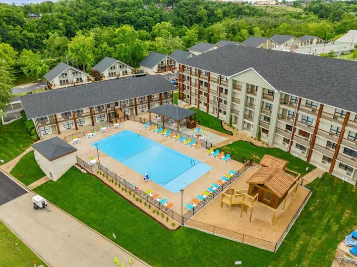 an aerial view of a swimming pool at a hotel at Roark Home Suites - Branson Landing, Gym, Indoor Pool in Branson