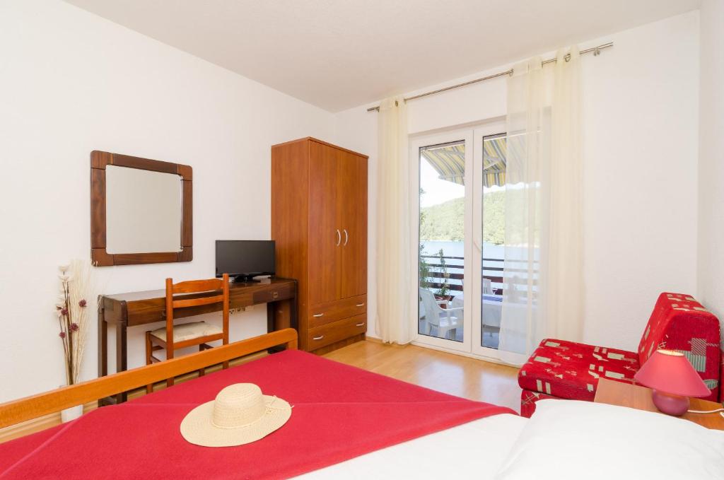 Postel nebo postele na pokoji v ubytování Apartments Matana Chano