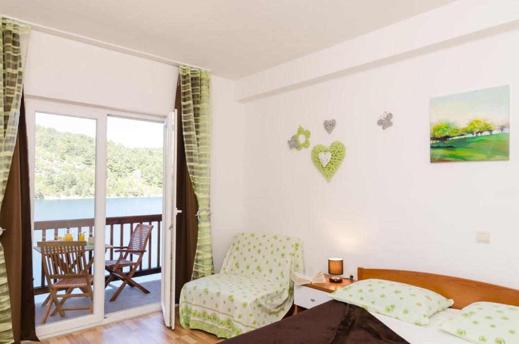 Postel nebo postele na pokoji v ubytování Apartments Matana Chano