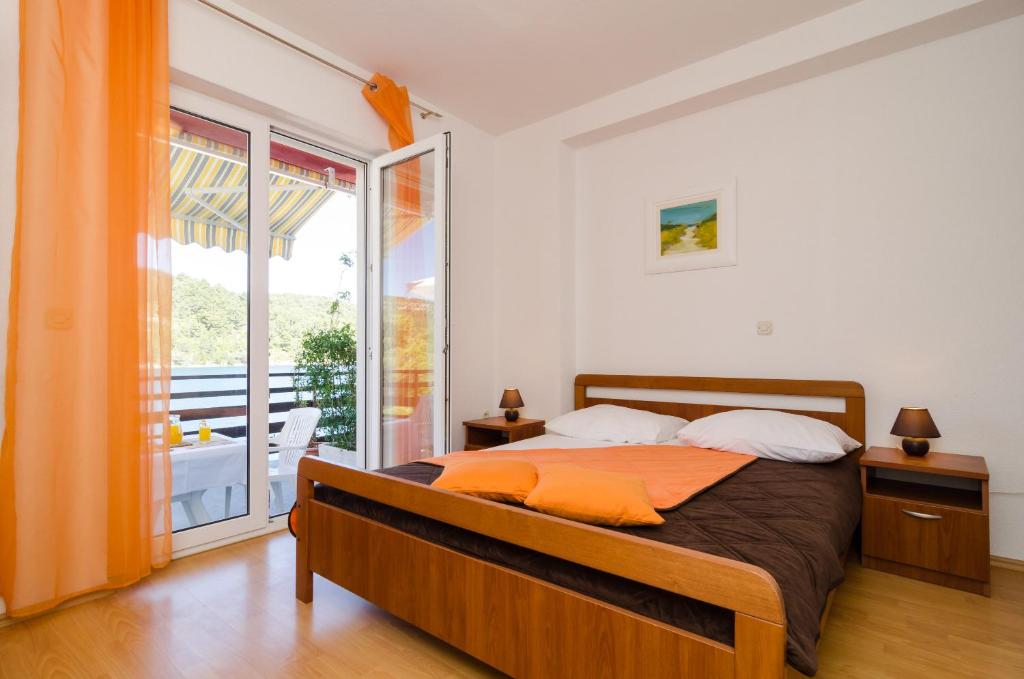 Postel nebo postele na pokoji v ubytování Apartments Matana Chano