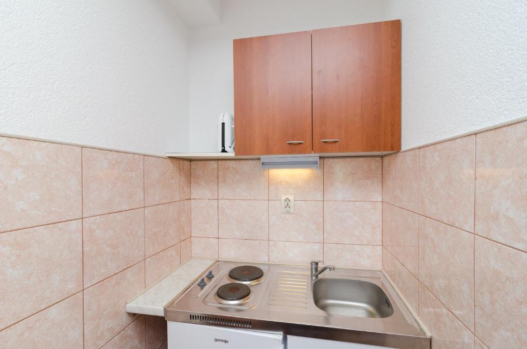 Kuchyň nebo kuchyňský kout v ubytování Apartments Matana Chano