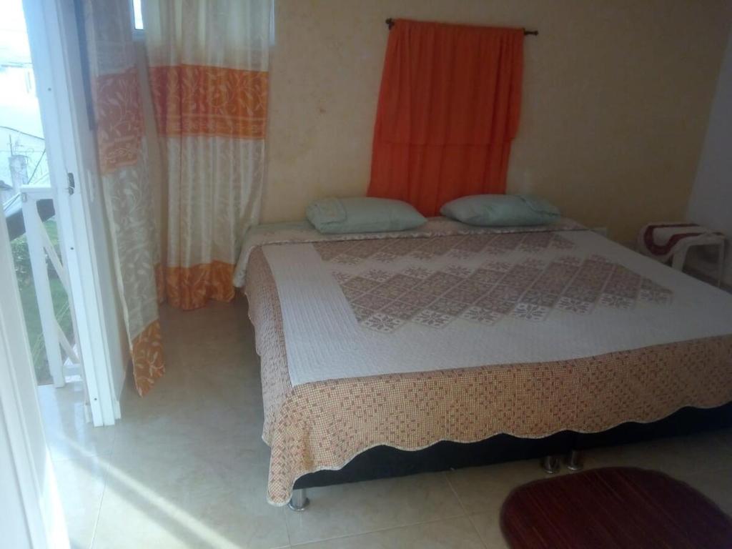 a bedroom with a bed and a window at double room # 2 in San Andrés