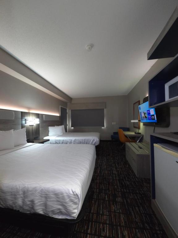 Reston Inn & Suites - Deluxe Queen Kamer Met 2 Queensize Bedden