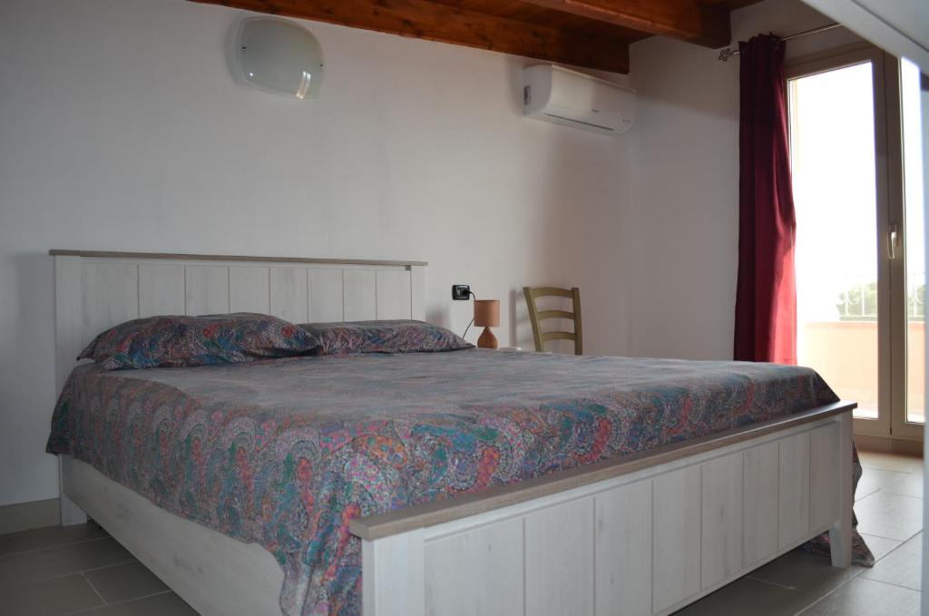 Postel nebo postele na pokoji v ubytování Terrazza sul golfo degli angeli
