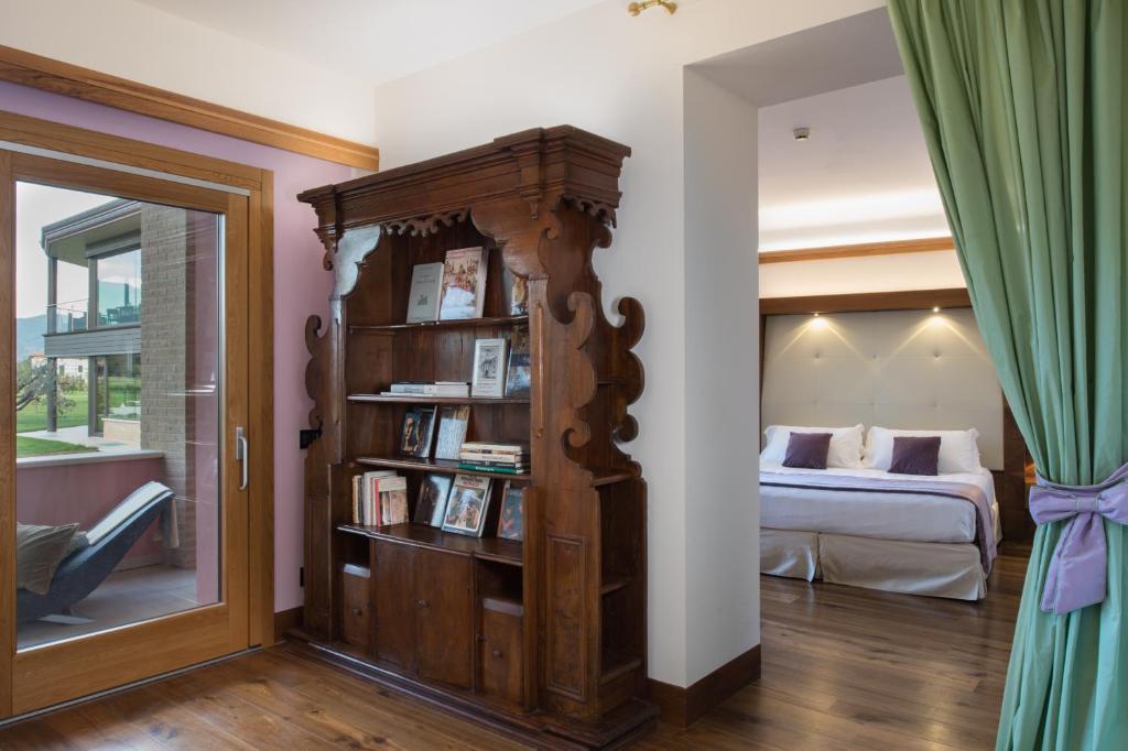 Postel nebo postele na pokoji v ubytování Valle di Assisi Hotel & Spa