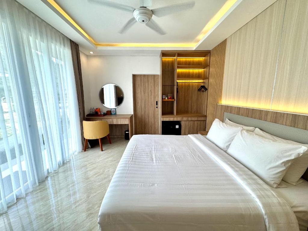 En eller flere senge i et værelse på Rusa by The Lake