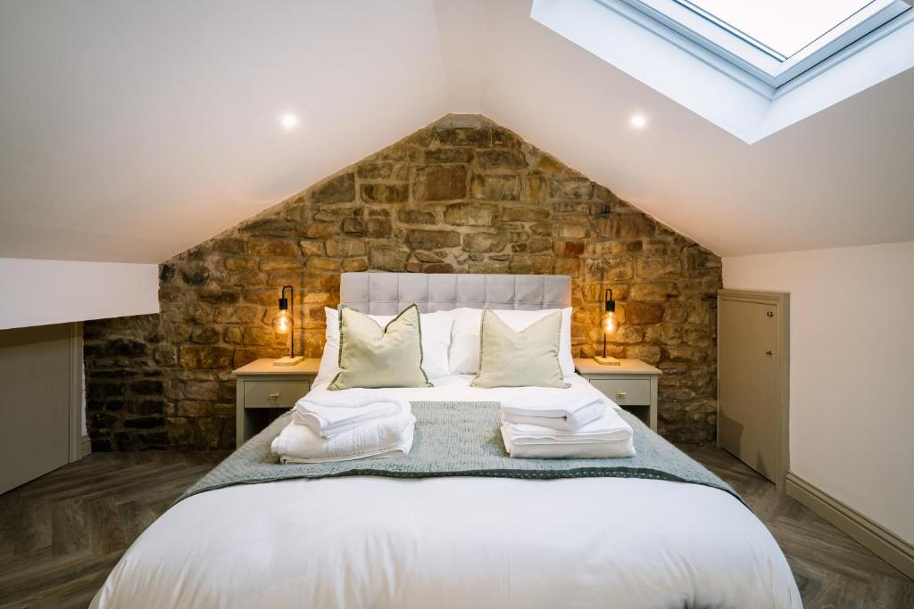 a bedroom with a large bed with two night stands at Sun Street Retreats in Lancaster