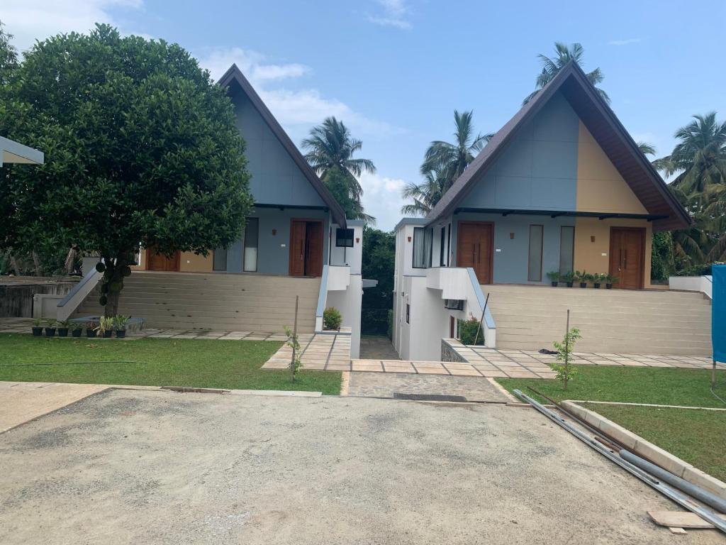 a house with a large driveway in front of it at Centri Villa in Anuradhapura