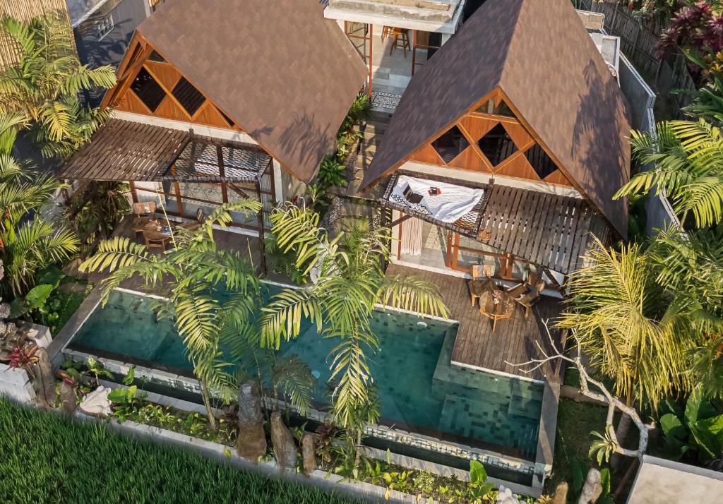 an overhead view of a resort with a swimming pool at Bara Villa by GenuineHost in Tegalalang