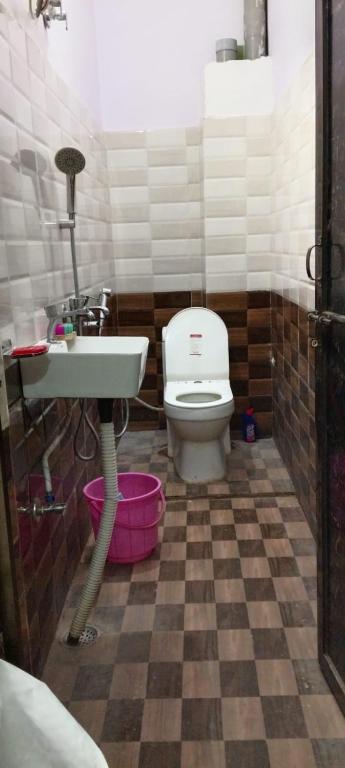 a bathroom with a sink and a toilet at Sabri Palace Ayodhya in Ayodhya