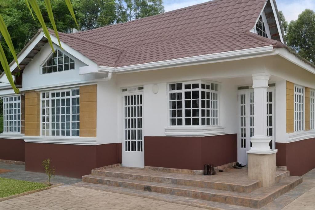 PauloArmana Elite Homes的红色屋顶的房子