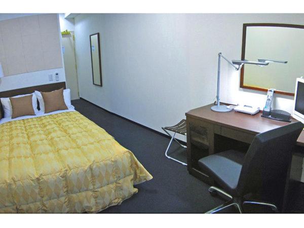 Postel nebo postele na pokoji v ubytování Fuchu Urban Hotel Annex