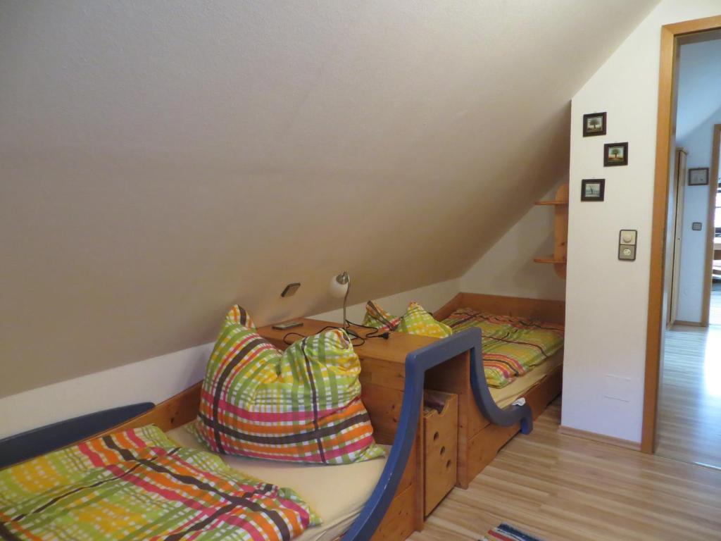 A bed or beds in a room at Ferienwohnungen Bauernhof Schilcher