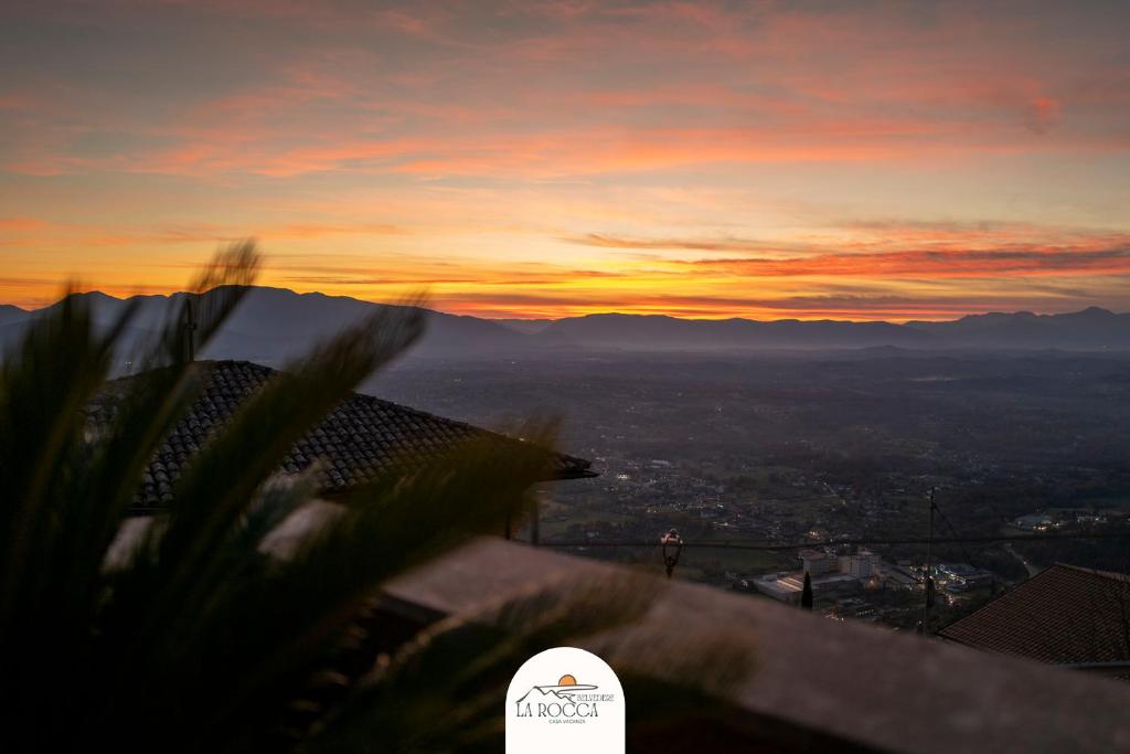 a view of the sunset from the top of a mountain at Belvedere la Rocca in Rocca dʼArce