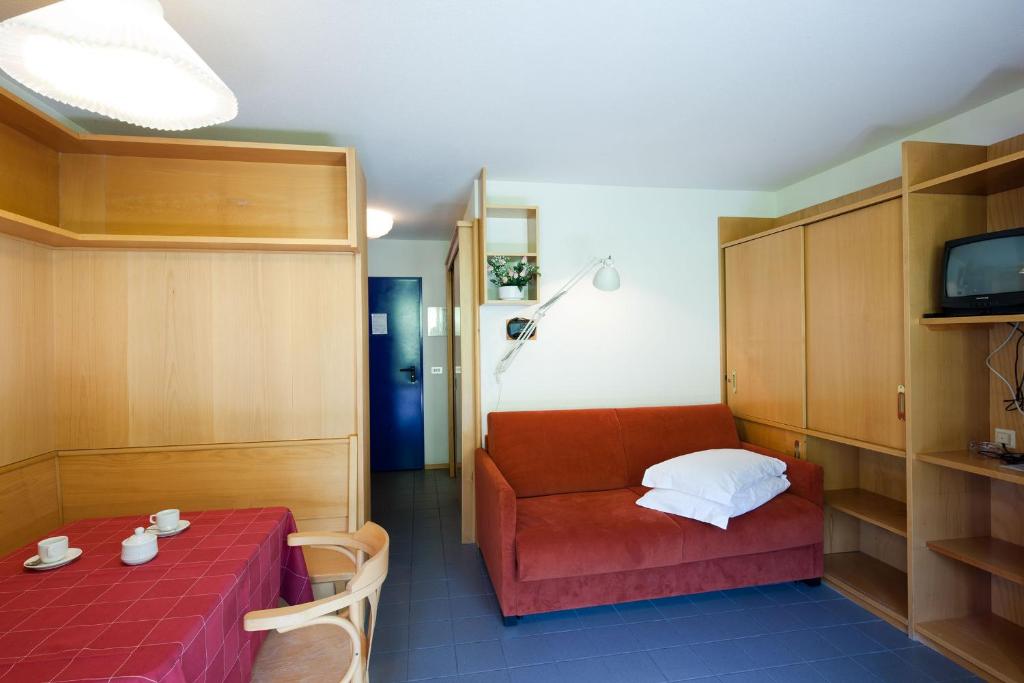 Postel nebo postele na pokoji v ubytování Residence Campolongo