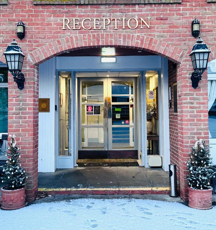an entrance to a store with an arched doorway at The March Hotel in March