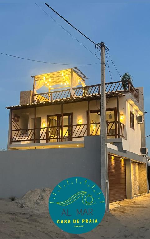 an all war house with a sign in front of it at Casa AL Mar - Praia do Preá in Prea