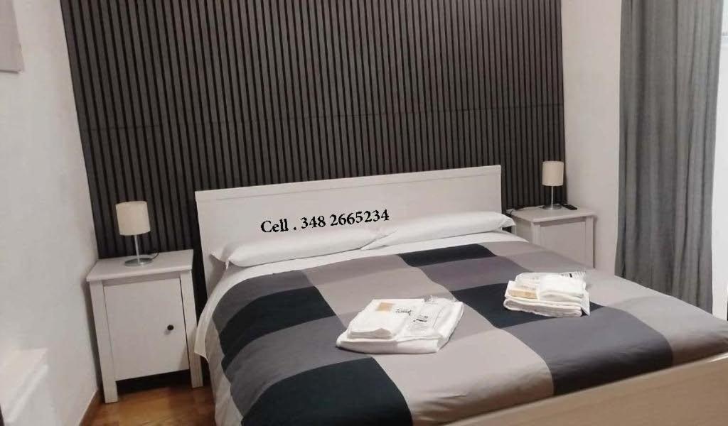 Postel nebo postele na pokoji v ubytování La Piazzetta B&B - Mini appartamento con ingresso indipendente