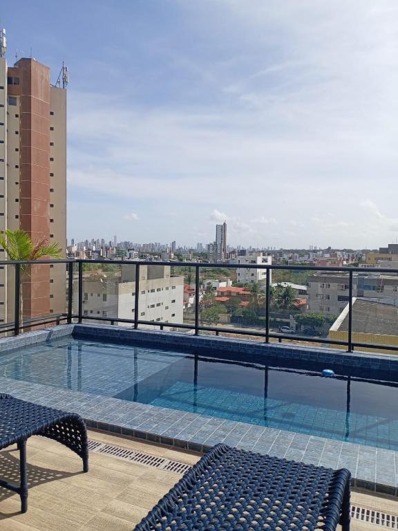 a swimming pool on the roof of a building at Flat Beach Way caminho da praia in Cabedelo