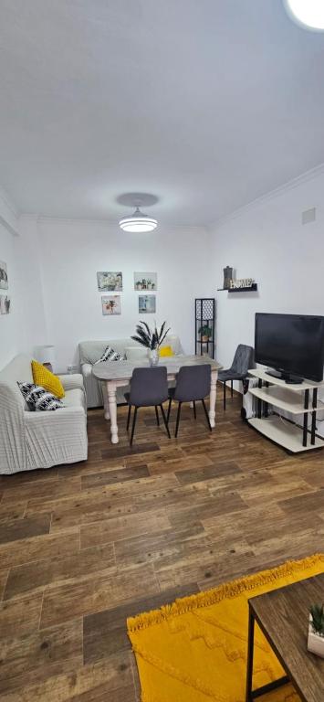 a living room with a couch and a table at La vagoneta in Cala
