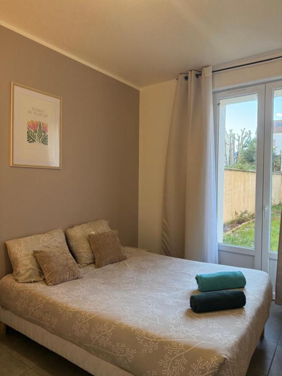 En eller flere senge i et værelse på Studio B1 - Centre-Ville Meaux - Proche Disneyland