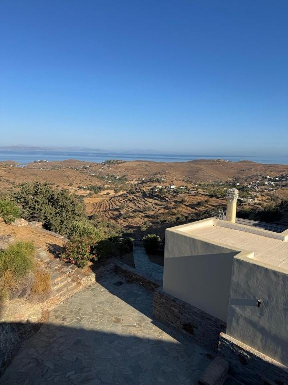 a view of the ocean from a house at Cycladic Serenity Sunset View Home in Otziás