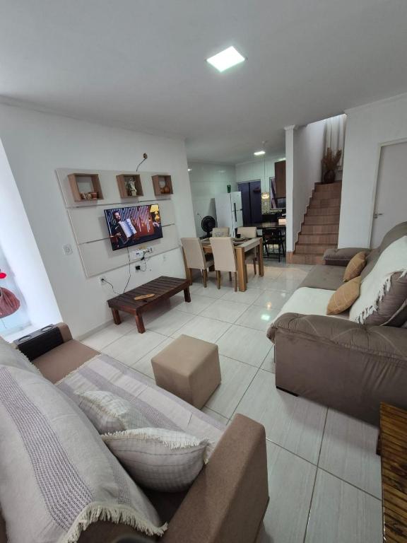a large living room with a couch and a table at Casa Marzenta in Petrolina