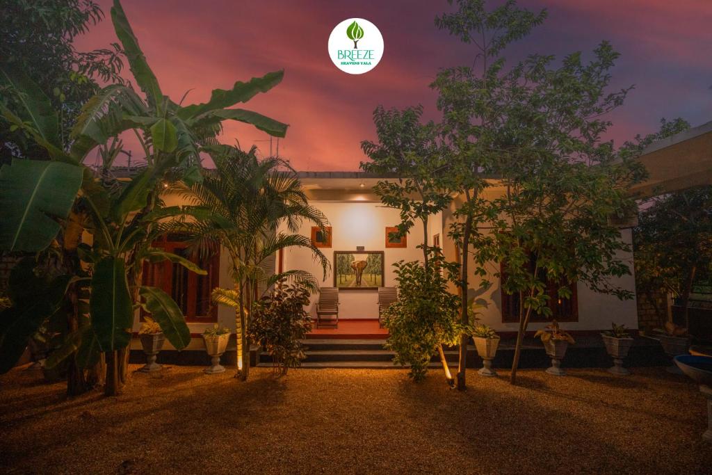 a house with trees in front of it at night at Breeze Heavens Yala in Polgahawelana