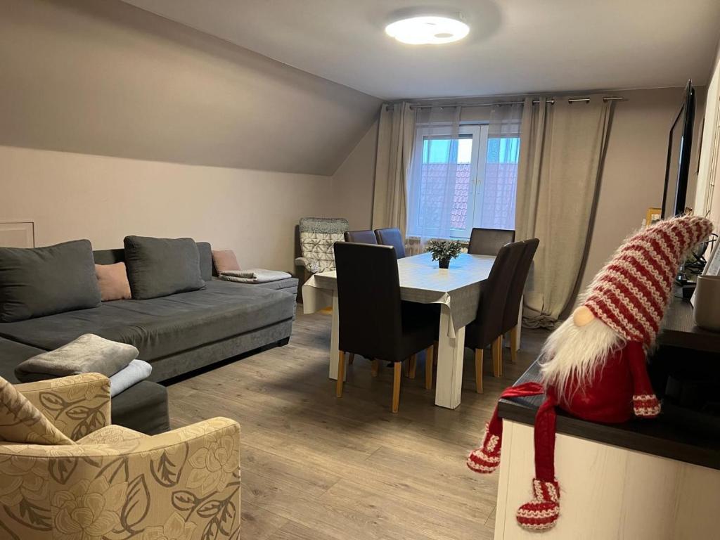 a living room with a couch and a table at Wohnung mit Fernblick in Jübek