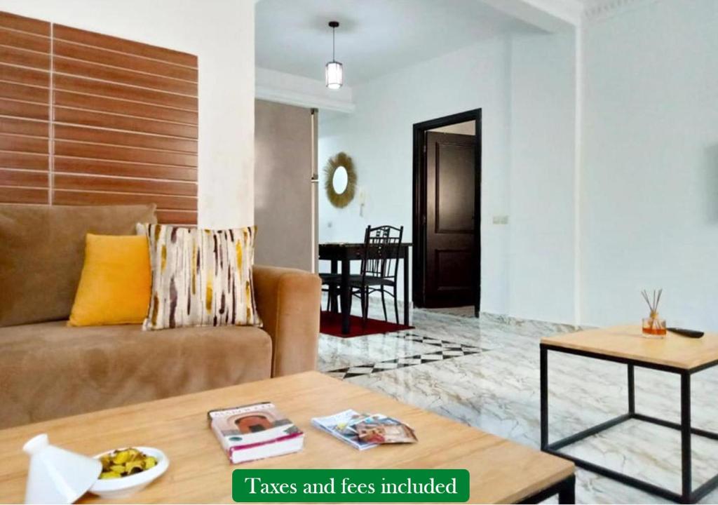 Et opholdsområde på Appartement Proche Plage avec Parking & Wi-Fi