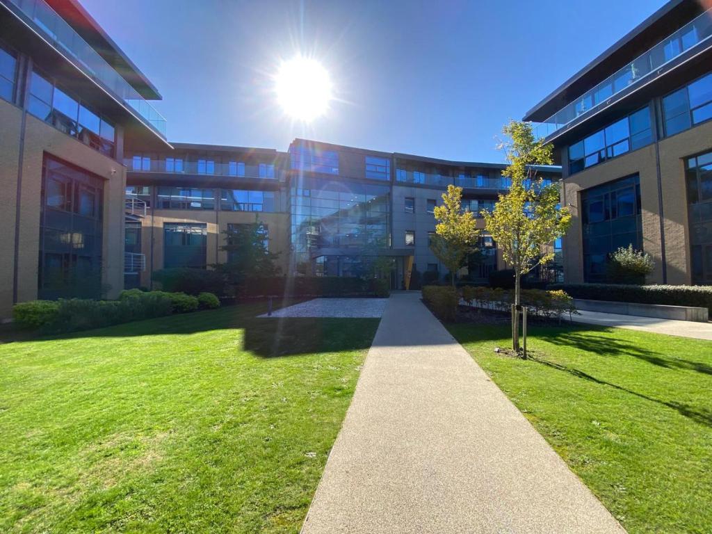 a building with a tree in front of it at Modern 2-Bed Apartment in Blu Bracknell in Bracknell