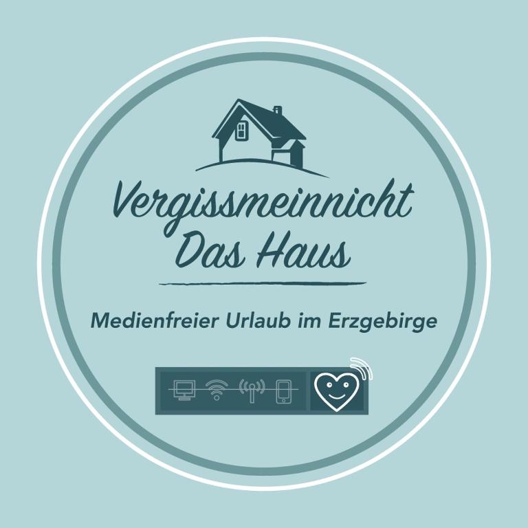 a sign for the observatories observatories day has with a house at Vergissmeinnicht - Das Haus in Kurort Oberwiesenthal