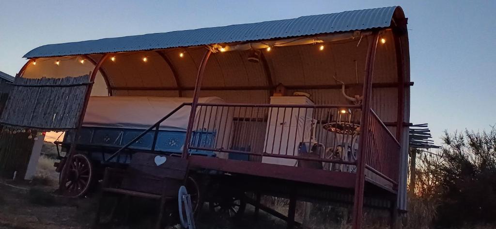 a large house with lights on top of it at Dopper Joris Bruidswa Adam se Uitspanning in Orania