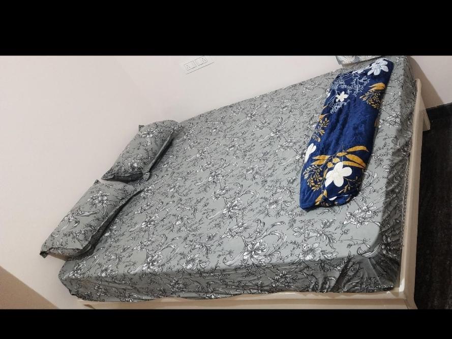 a knife is sitting on top of a bed at Powerstar home stay in Hampi