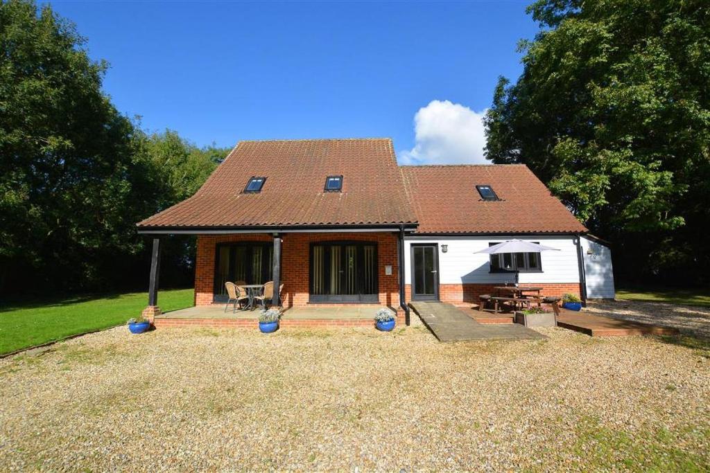 a small house with a red roof at 3 Bed in Thursford oc-2370 in Thursford