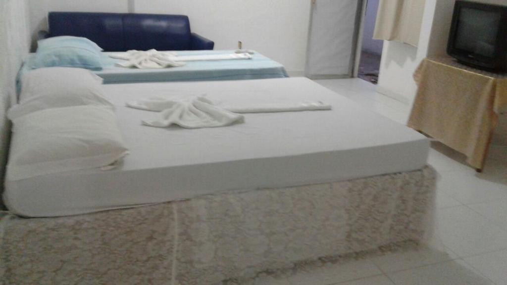 Postel nebo postele na pokoji v ubytování Hotel Porto da Lua Belém